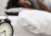 woman sleeping sleep arousal clock