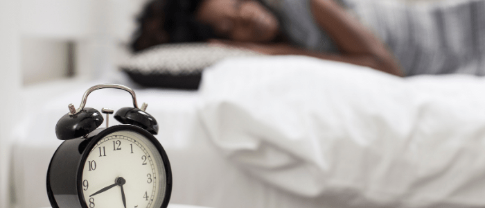 woman sleeping sleep arousal clock